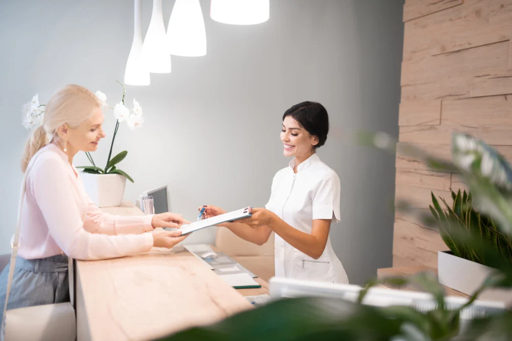 Dental clinic reception and friendly team workspace